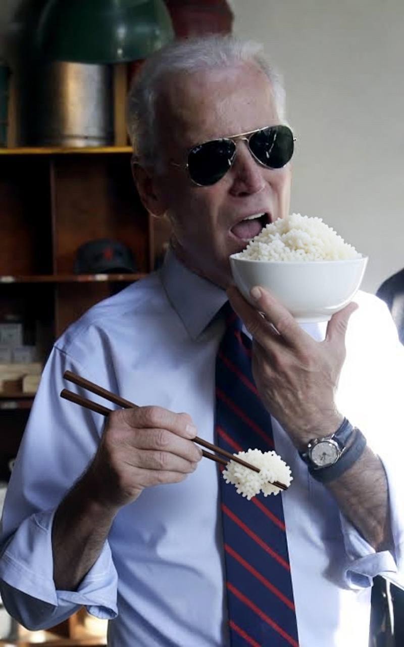 Biden eating from a takeout box of rice